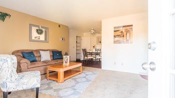 Somerpointe living room with cozy couches, and carpet flooring